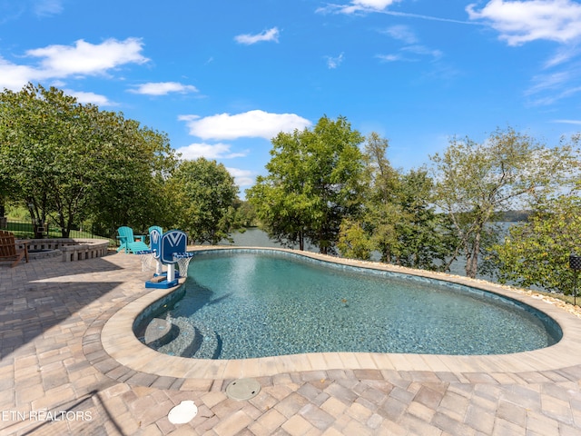 view of swimming pool with a patio