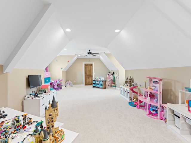 rec room featuring lofted ceiling, ceiling fan, and carpet