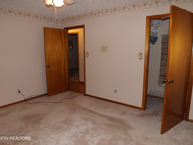 unfurnished bedroom with light carpet