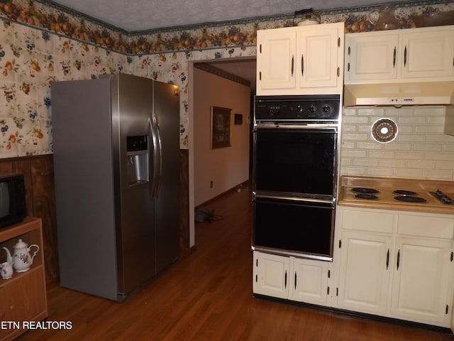 kitchen featuring white cabinetry, black appliances, and extractor fan