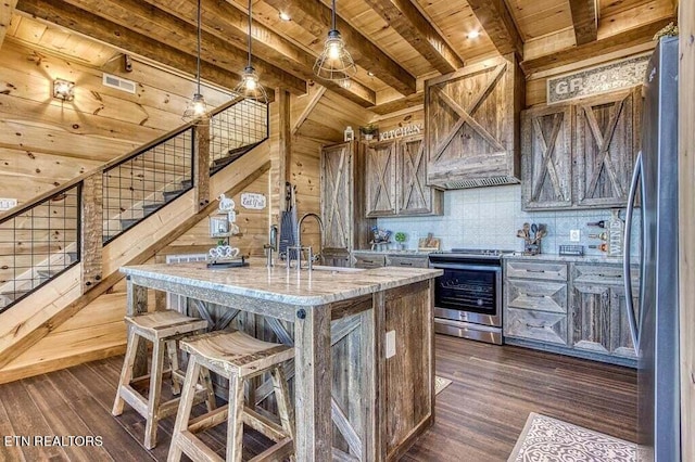 kitchen featuring appliances with stainless steel finishes, wood ceiling, pendant lighting, and dark hardwood / wood-style flooring