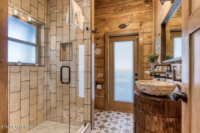 bathroom featuring vanity and a shower with shower door