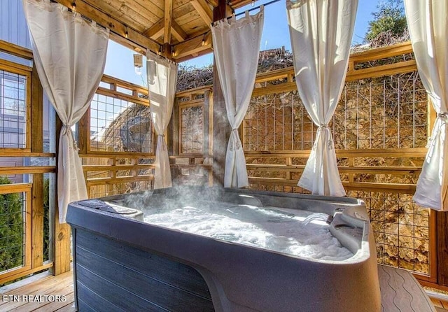 details featuring a hot tub and wooden ceiling