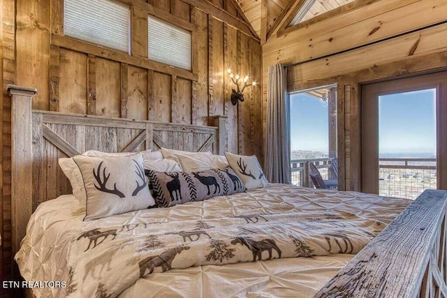 bedroom with lofted ceiling, access to outside, and wooden walls