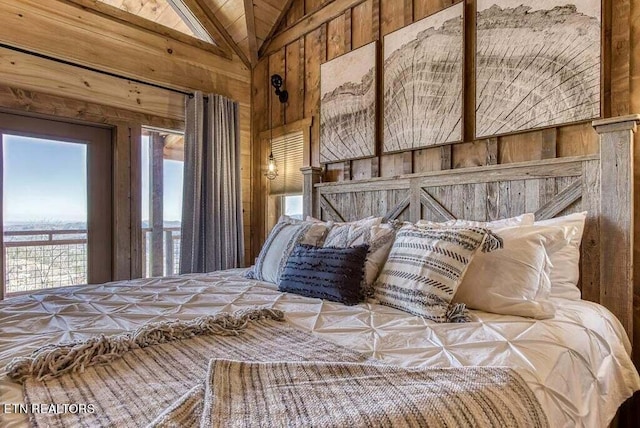 unfurnished bedroom featuring vaulted ceiling and wood walls