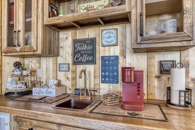 kitchen with wooden walls and sink