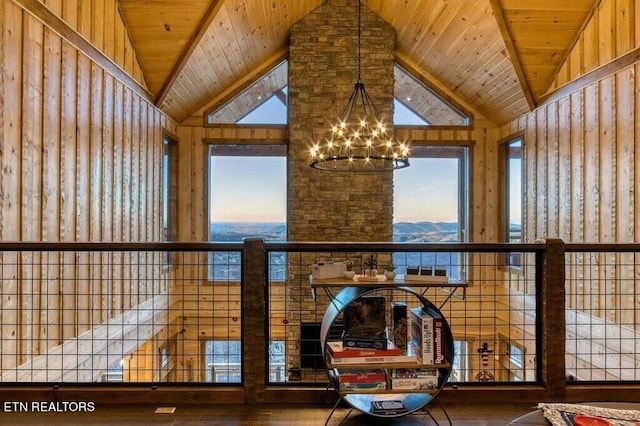 details with wood ceiling, an inviting chandelier, and wood-type flooring