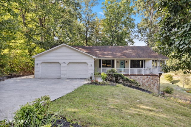 ranch-style house with a front lawn, a garage, and covered porch