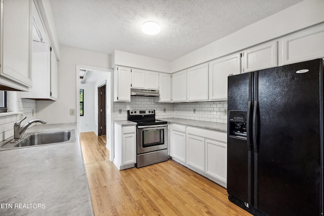 kitchen with stainless steel electric stove, black refrigerator with ice dispenser, light hardwood / wood-style floors, sink, and white cabinets