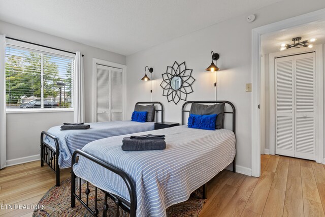 bedroom with light wood-type flooring