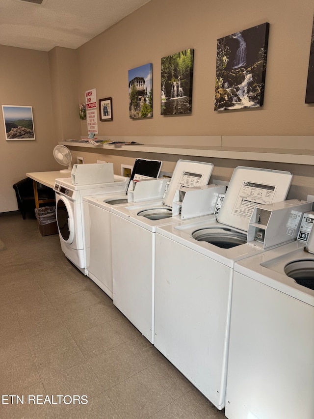 laundry room with washing machine and clothes dryer