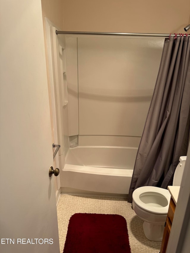 full bathroom with vanity, toilet, and shower / tub combo