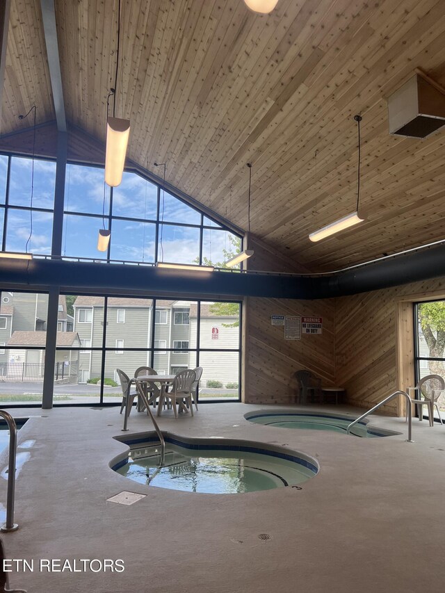 view of swimming pool featuring an indoor in ground hot tub