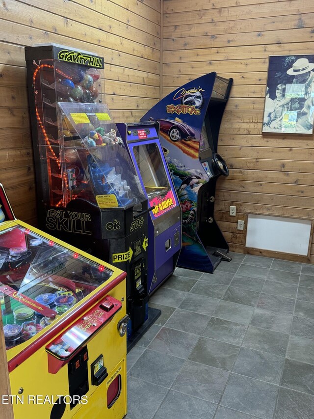 game room featuring wooden walls