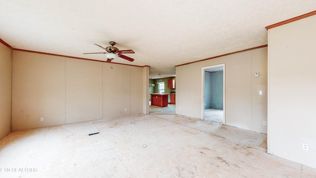 interior space featuring ornamental molding, a textured ceiling, and ceiling fan