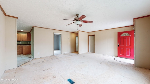 unfurnished bedroom featuring ceiling fan, connected bathroom, a textured ceiling, and ornamental molding