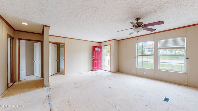 unfurnished bedroom with ceiling fan, a textured ceiling, and ornamental molding