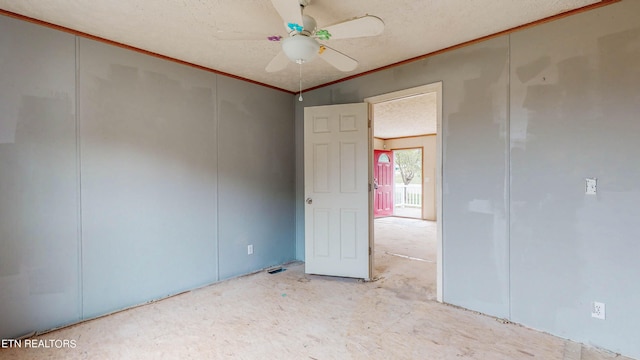 unfurnished bedroom with ceiling fan, crown molding, and a textured ceiling