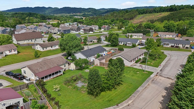 birds eye view of property with a mountain view