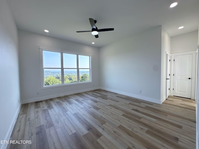 unfurnished room featuring recessed lighting, ceiling fan, baseboards, and wood finished floors