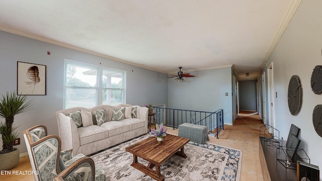 living room with light wood-type flooring, ornamental molding, and ceiling fan