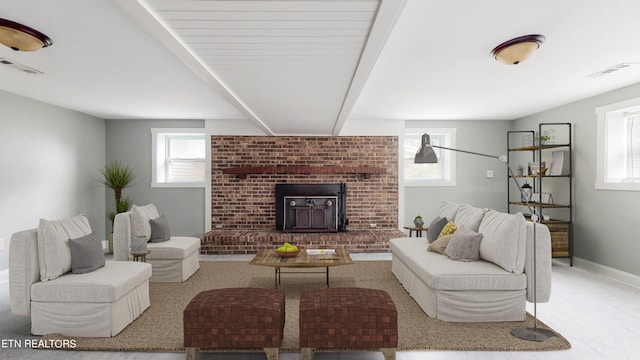 living room with carpet flooring and a brick fireplace