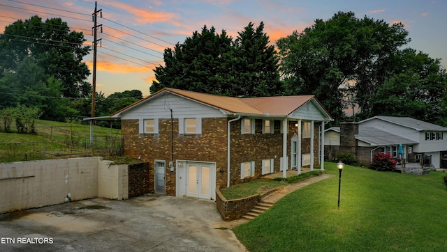 view of front of home with a lawn