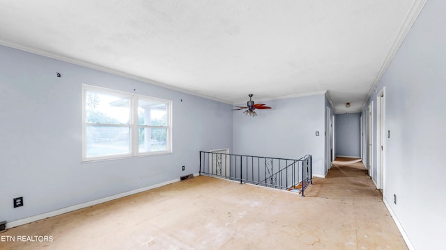 unfurnished room featuring ceiling fan and ornamental molding