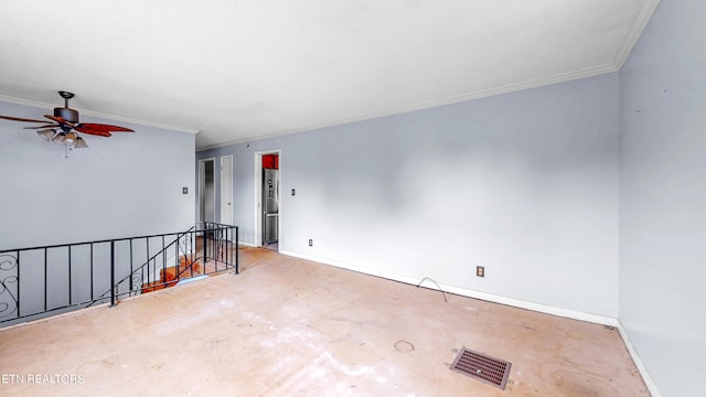 spare room featuring ceiling fan and ornamental molding