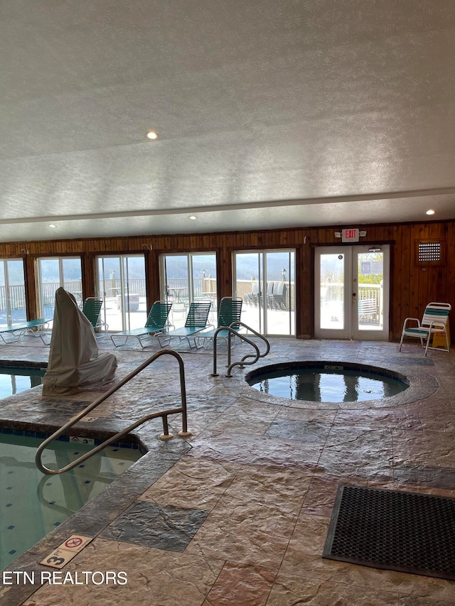 view of pool featuring an indoor hot tub and french doors