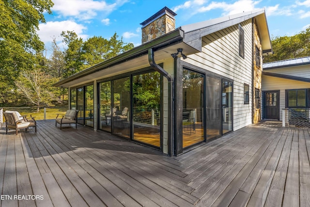 wooden terrace with a sunroom