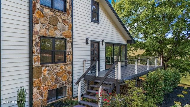 rear view of property with a sunroom