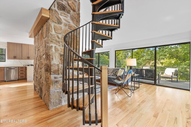 staircase with wood-type flooring