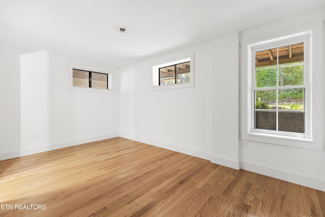 spare room with light hardwood / wood-style floors