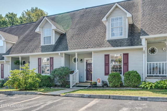 cape cod home with a porch