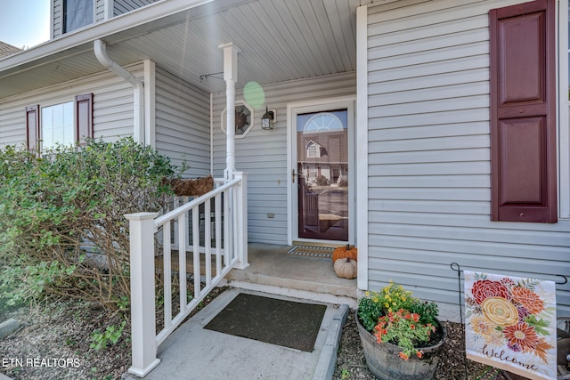 doorway to property with a porch