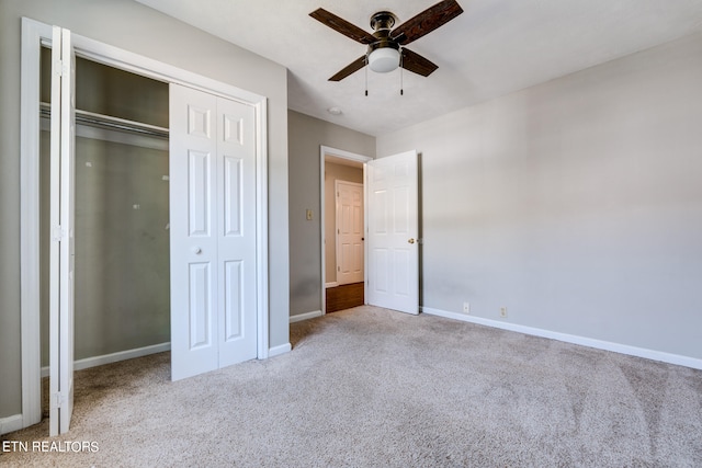 unfurnished bedroom featuring ceiling fan and light carpet