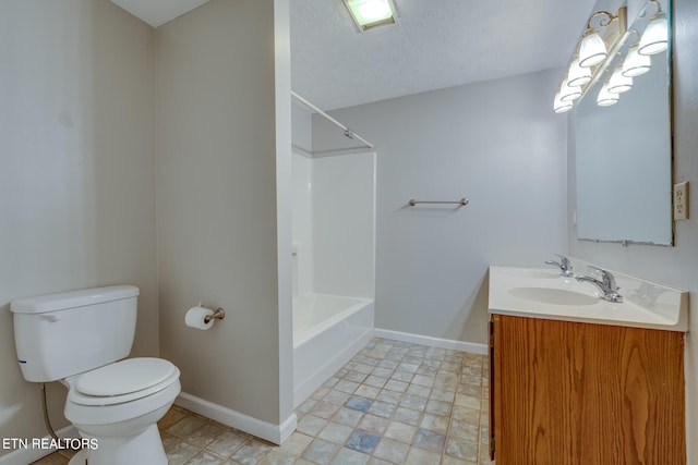 full bathroom with vanity, toilet, tub / shower combination, and a textured ceiling