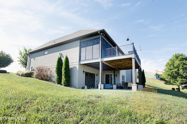 275 Hummingbird Dr, Vonore, TN 37885 - back of house with a lawn, an attached garage, and a wooden deck