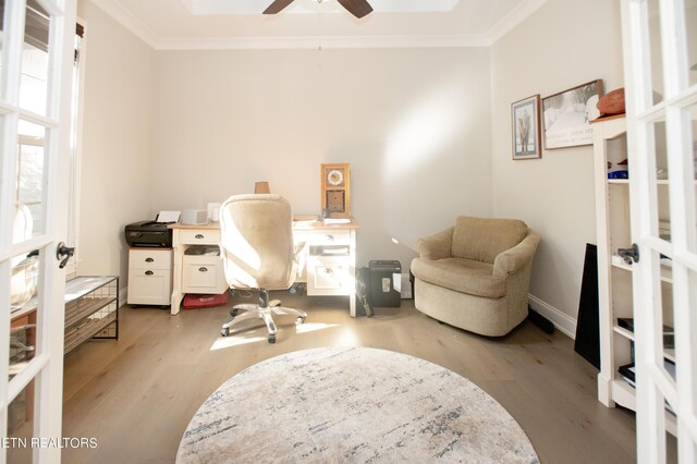 office area featuring crown molding, ceiling fan, light wood-type flooring, and french doors