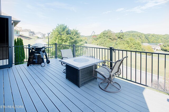 wooden deck with area for grilling