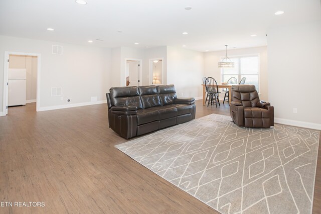 living room with light hardwood / wood-style floors