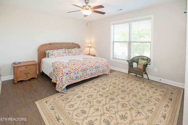 bedroom with hardwood / wood-style floors and ceiling fan