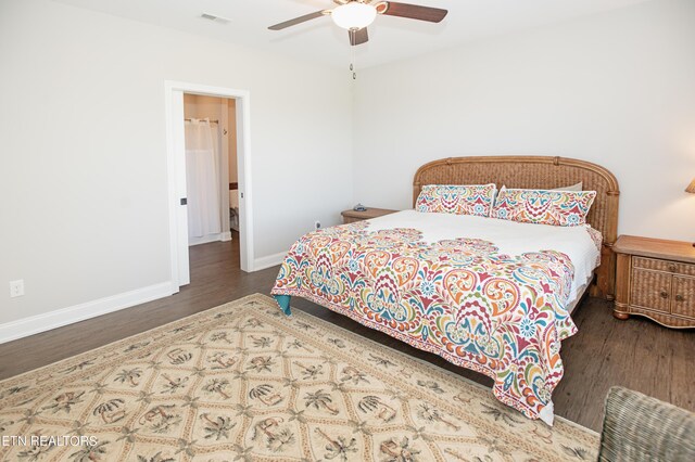 bedroom with dark hardwood / wood-style flooring and ceiling fan