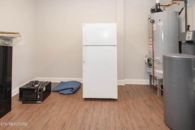 utility room featuring gas water heater