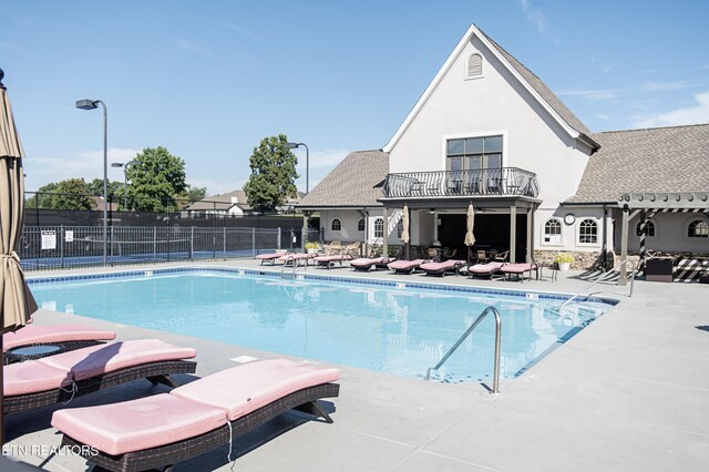 view of swimming pool with a patio