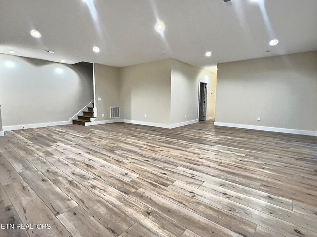 empty room with light hardwood / wood-style floors