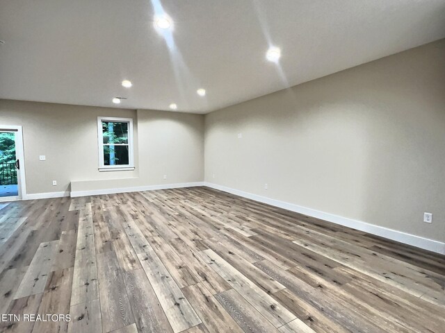 empty room with hardwood / wood-style floors