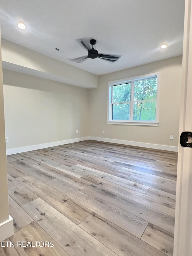 spare room featuring visible vents, baseboards, ceiling fan, recessed lighting, and hardwood / wood-style floors