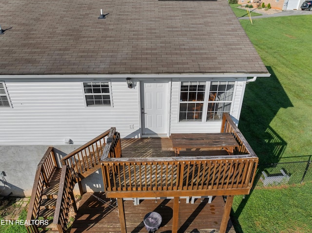 deck featuring a lawn